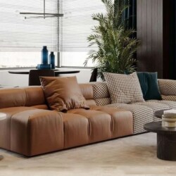 Sofa băng SFA30-4 phong cách hiện đại, chụp từ góc ngang, nổi bật với sự kết hợp vật liệu độc đáo: phần bên trái bọc da nh…