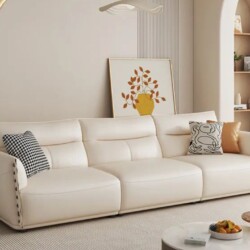 Sofa băng SFA40-4 ba chỗ ngồi, chụp chính diện trong không gian phòng khách hiện đại. Ghế có thiết kế tối giản, bọc da màu…