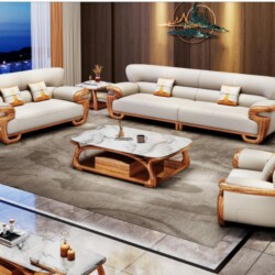 Bộ sofa gỗ mun SB322-124 gồm 1 băng dài, 1 băng đôi và 1 ghế đơn, cùng bàn trà và bàn phụ, đặt trong phòng khách sang trọn…