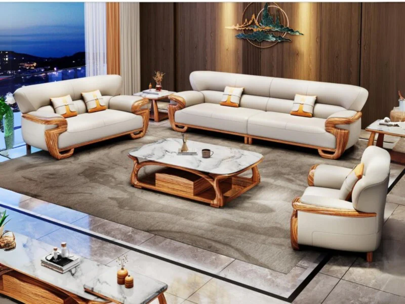 Bộ sofa gỗ mun SB322-124 gồm 1 băng dài, 1 băng đôi và 1 ghế đơn, cùng bàn trà và bàn phụ, đặt trong phòng khách sang trọn…