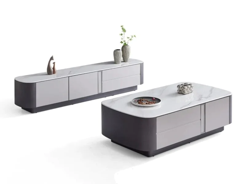 Bộ bàn trà và kệ tivi BTK6101-14KT được chụp từ góc chếch phía trước, nổi bật trên nền trắng. Bàn trà hình chữ nhật bo trò…