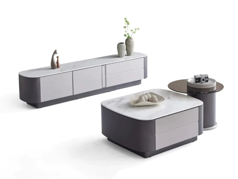 Bộ sản phẩm nội thất phòng khách hiện đại gồm bàn trà đôi và kệ tivi, chụp từ góc hơi cao trên nền trắng. Bàn trà lớn hình…