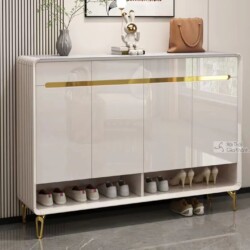 Tủ giày TDB504 màu trắng bóng, phong cách hiện đại, đặt trong không gian tiền sảnh. Tủ có mặt trên bằng đá vân xám, ba cán…