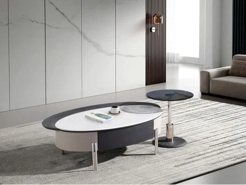 Bàn trà đôi BT2521A chụp từ góc hơi cao, chếch phía trước, làm nổi bật bàn chính hình oval mặt đá vi tinh thể trắng viền đ…
