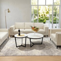 Tổng thể không gian phòng khách hiện đại với bộ bàn trà đôi chân Y cao đặt giữa bộ sofa màu kem. Hai bàn tròn mặt đá trắng…