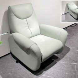 Ghế thư giãn điện E72 màu xanh mint nhạt, chụp từ góc hơi chếch phía trước bên phải, đặt trên sàn gạch xám. Ghế có kiểu dá…