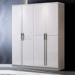 Tủ quần áo 4 cánh TU1901 màu trắng tinh tế, được chụp chính diện trong không gian phòng ngủ tối giản. Tủ có thiết kế hiện…