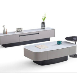 Bàn trà đôi BT6205 hình oval, cùng kệ tivi và bàn phụ tròn, chụp từ góc chếch trên nền trắng. Thiết kế hiện đại với mặt đá…