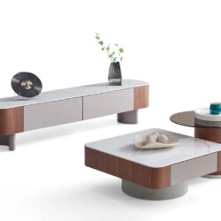 Bộ bàn trà đôi BTK6107 và kệ tivi hiện đại, chụp góc chếch trên nền trắng. Bàn trà chính vuông, mặt đá trắng vân xám, chân…