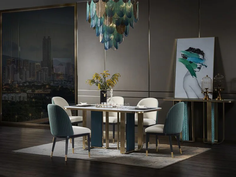 Bàn ăn mặt đá 1m8 BAQT163-18 phong cách Luxury, chụp từ góc hơi chếch bên trái, làm nổi bật mặt đá phiến mờ màu trắng vân…