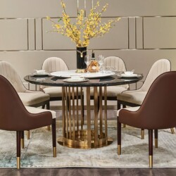 Bộ bàn ăn tròn BBQT010-135 phong cách hiện đại, chụp chính diện trong không gian phòng ăn sang trọng. Bàn có mặt đá cẩm th…