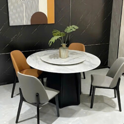 Bộ bàn ăn tròn HY-130 phong cách hiện đại được chụp từ góc chính diện trong không gian phòng ăn. Bàn có mặt đá cẩm thạch n…