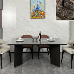 Bàn ăn mặt đá hiện đại BAYYT-076-18 được chụp chính diện trong không gian phòng ăn sang trọng. Mặt bàn hình chữ nhật bằng…