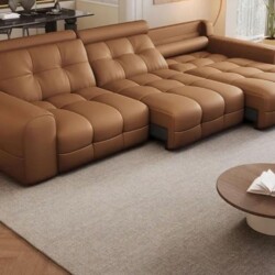 Sofa chỉnh điện SF-A1301 màu da bò, được chụp từ góc trên hơi chếch, cho thấy toàn bộ thiết kế hình chữ L hiện đại. Ghế có…