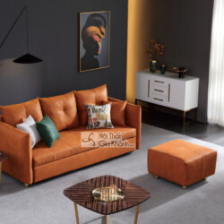 Sofa băng 3 màu cam đất bọc vải, đặt trong phòng khách hiện đại với tường xám đậm. Kèm theo là một đôn rời cùng màu, bàn t…