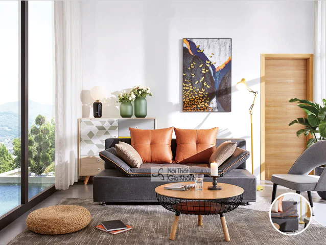 Sofa giường đa năng SF169-15G màu xám đậm, chụp toàn cảnh trong phòng khách hiện đại. Sofa có tựa tay điều chỉnh, đi kèm g…