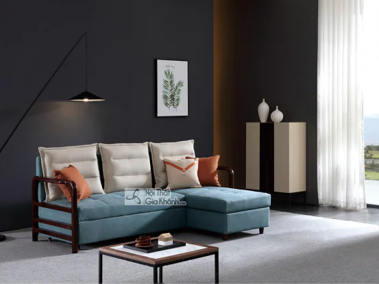 Ghế sofa góc kiêm giường ngủ thông minh SF273B-2G màu xanh ngọc bích, đặt trong không gian phòng khách hiện đại. Sofa có t…