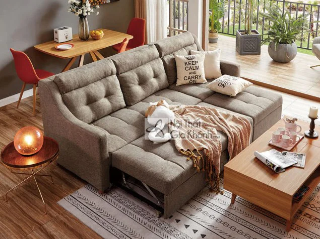 Sofa góc chữ U thông minh bọc vải màu ghi be, đặt trong không gian phòng khách hiện đại. Sofa có tựa lưng rút múi và đệm n…