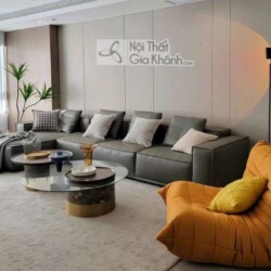 Hình ảnh toàn cảnh phòng khách sang trọng, chụp từ phía trước bên phải, bao quát bộ sofa góc phải SF1801GP và các đồ nội t…