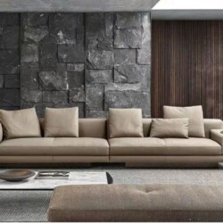 Sofa băng ba chỗ ngồi SFA32-33 màu nâu be nhạt, bọc da tự nhiên, đặt trong không gian phòng khách hiện đại. Sofa có thiết…