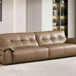 Ảnh chụp toàn cảnh sofa băng SFB8166 màu nâu be đặt trong không gian phòng khách hiện đại. Sofa có thiết kế tối giản với t…