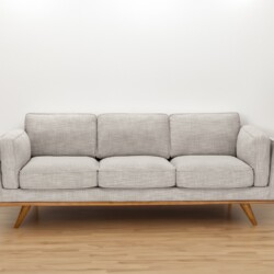 Ghế sofa băng 3 chỗ màu be nhạt đặt trong không gian phòng khách tối giản, tường trắng và sàn gỗ sáng màu. Bên cạnh là một…
