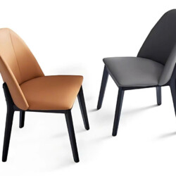 Hai chiếc ghế ăn hiện đại GA888 được chụp từ góc hơi nghiêng, một chiếc màu nâu da bò và một chiếc màu xám, nổi bật trên n…