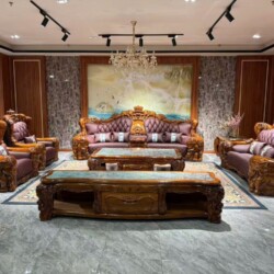 Bộ sofa gỗ Mun nhập khẩu GM2220-1125 được chụp toàn cảnh từ phía trước, trưng bày trong không gian phòng khách sang trọng…