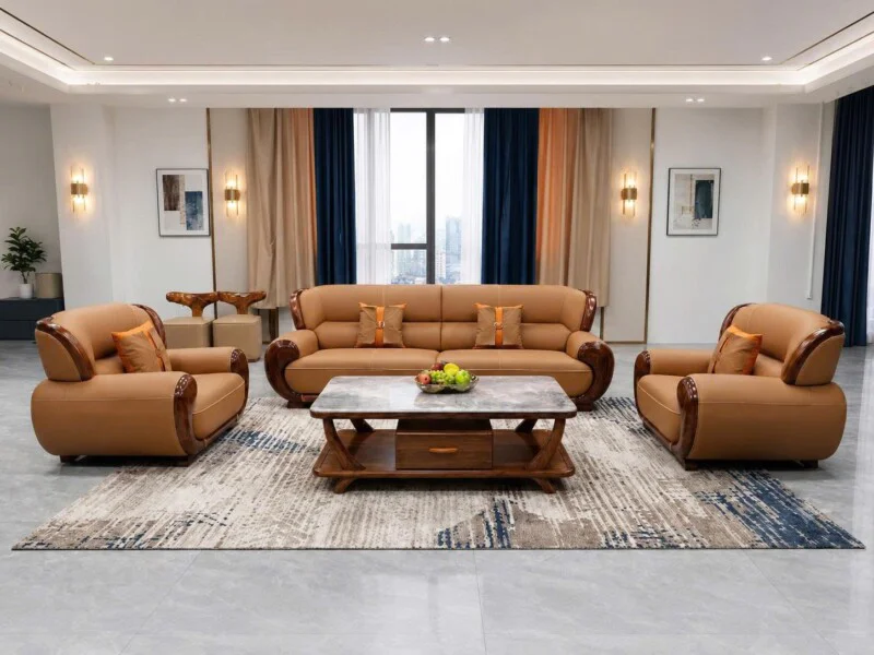 Bộ sofa ARCO SBF311-114 gồm một băng dài và hai ghế đơn, bọc da màu nâu vàng, với khung gỗ Mun tự nhiên uốn lượn ở tay vịn…
