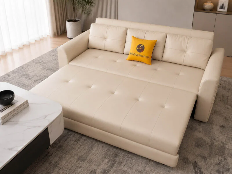 Góc chụp từ trên cao xuống, thể hiện sofa giường Lamia C1004 màu kem đang trong quá trình mở ra thành giường. Phần đệm ngồ…