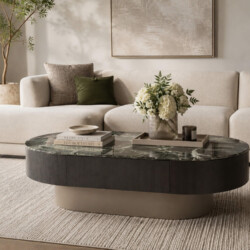 Góc chụp chếch của bộ bàn trà đôi ARDO, làm nổi bật mặt đá vân xanh độc đáo của bàn lớn hình bầu dục và mặt kính đen của b…